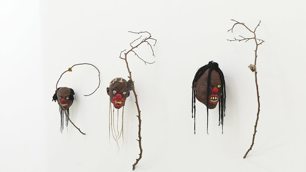 masks on a white wall
