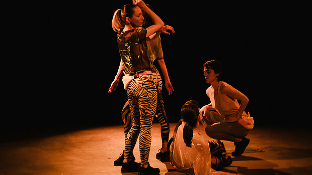 dancers posing on stage during Code Red