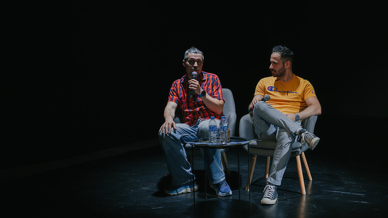 Anton Ovchinnikov & Kosta Karakashyan on stage, black background.