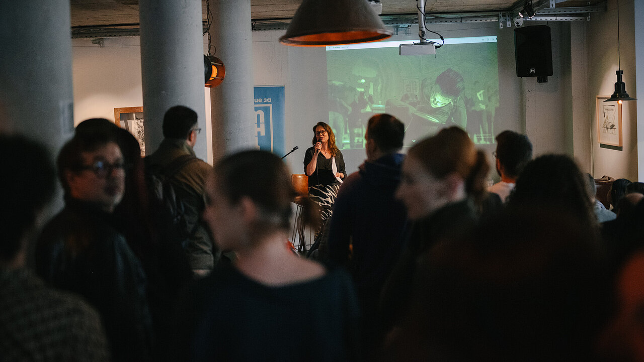 Angelina Georgieva presenting Dance Magazine #7 in front of a crowd.
