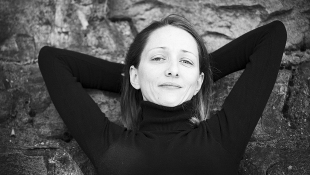 Portrait of actress Martina Apostolova, her arms behind her head, black and white