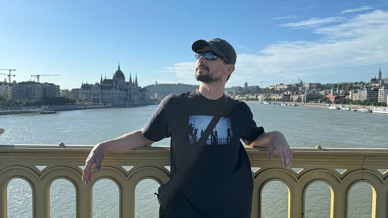 James Batchelor in front of the Danube in Budapest