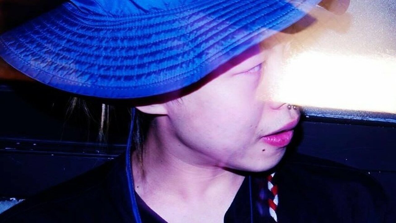 Portrait of Kidows Kim wearing a blue hat