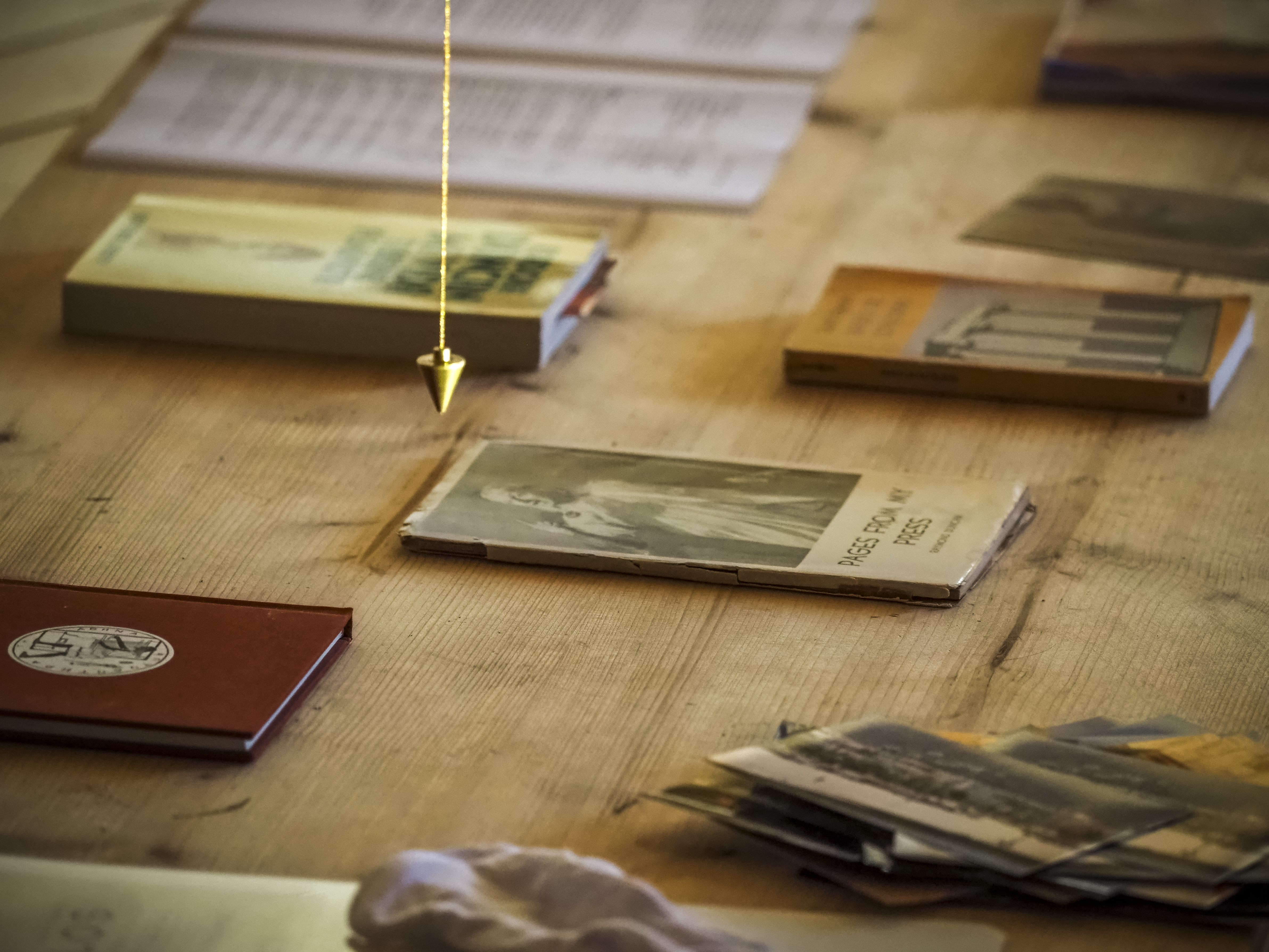 some books and a pendulum